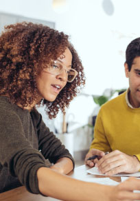 two people looking over paperwork 