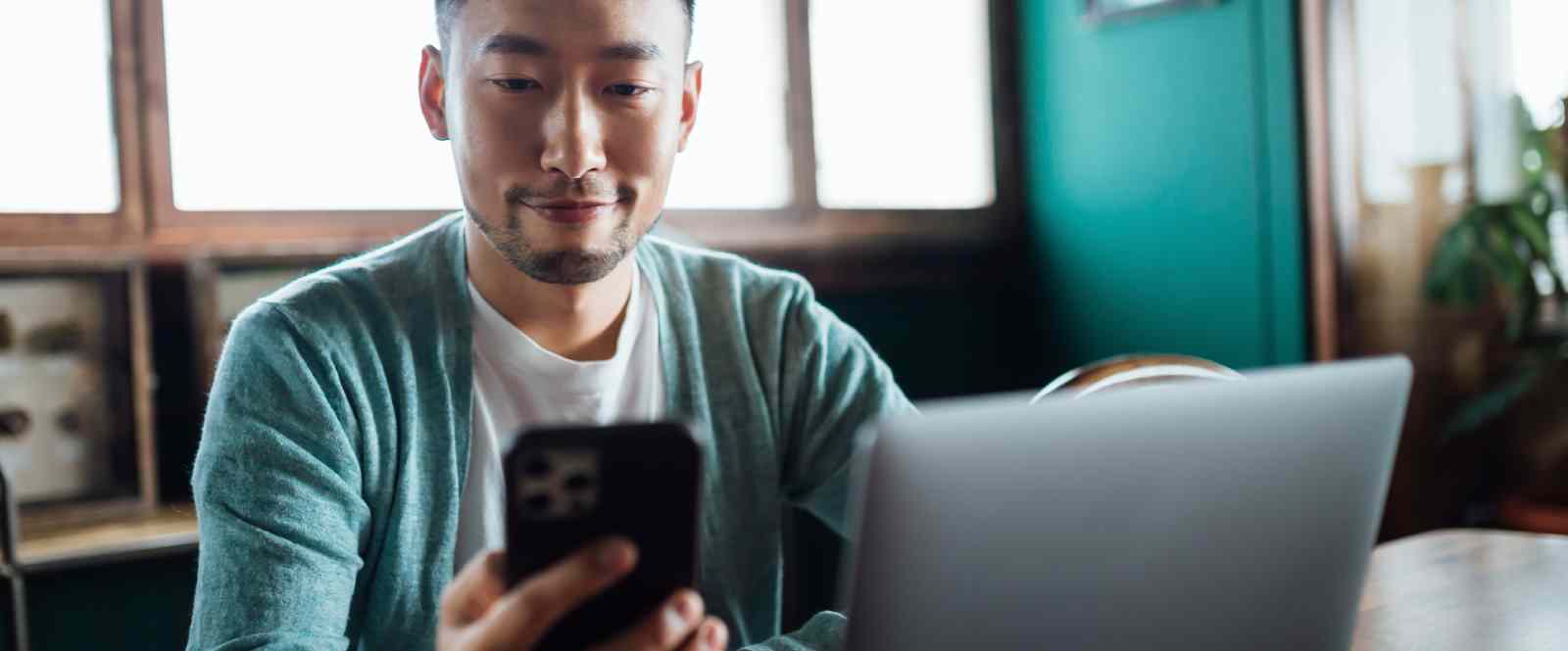 man looking at phone